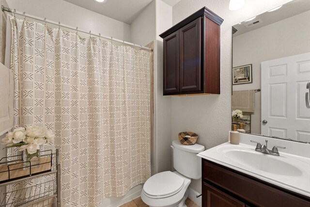 17222 Fable Springs Ln, Cypress, TX 77433 - bathroom featuring vanity, toilet, and curtained shower