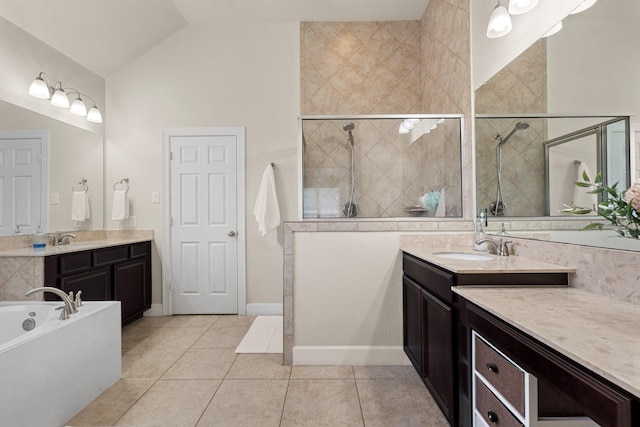 17222 Fable Springs Ln, Cypress, TX 77433 - bathroom featuring tiled shower, lofted ceiling, a bath, tile patterned floors, and two vanities