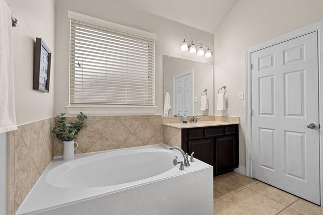 17222 Fable Springs Ln, Cypress, TX 77433 - bathroom with a garden tub, vanity, and tile patterned flooring