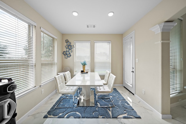 3627 Grand Promenade Ln, Stafford, TX 77477 - dining area featuring light marble finish flooring, baseboards, plenty of natural light, and recessed lighting