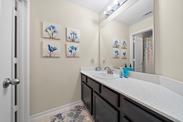 3627 Grand Promenade Ln, Stafford, TX 77477 - full bath with vanity and baseboards