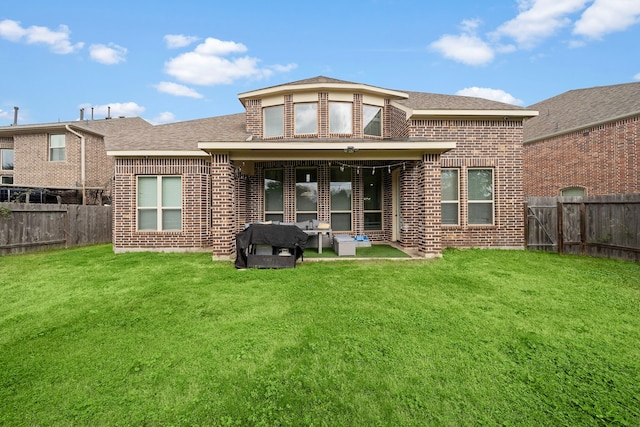 3627 Grand Promenade Ln, Stafford, TX 77477 - rear view of property featuring brick siding and a shingled roof