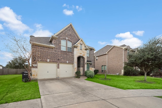 3627 Grand Promenade Ln, Stafford, TX 77477 - french country style house with brick siding, concrete driveway, a garage, and stone siding