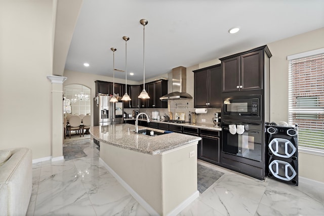 3627 Grand Promenade Ln, Stafford, TX 77477 - kitchen with wall chimney exhaust hood, black appliances, a sink, light marble finish floors, and recessed lighting