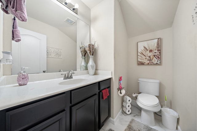 3627 Grand Promenade Ln, Stafford, TX 77477 - bathroom with marble finish floors, toilet, vaulted ceiling, and vanity
