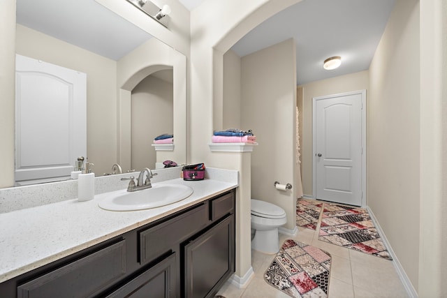 3627 Grand Promenade Ln, Stafford, TX 77477 - bathroom with toilet, vanity, tile patterned floors, and baseboards
