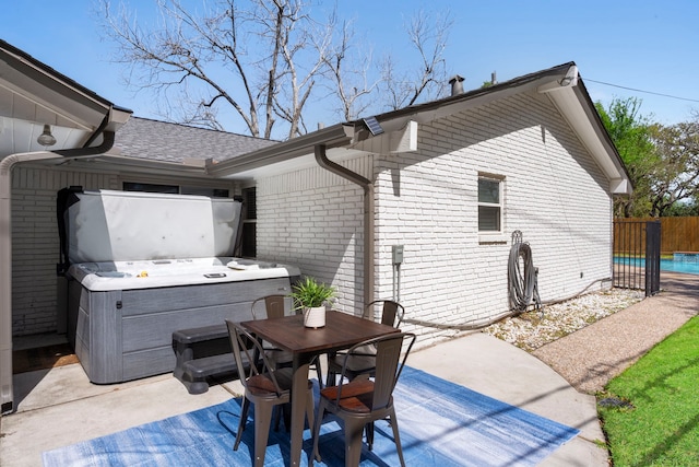 3531 Westridge St, Houston, TX 77025 - view of patio with a hot tub, fence, and outdoor dining area