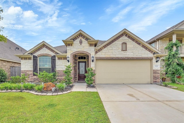 2255 Golden Laurel Dr, Conroe, TX 77304 - french country inspired facade with a front yard, an attached garage, driveway, stone siding, and brick siding