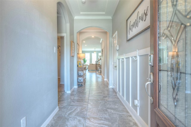2255 Golden Laurel Dr, Conroe, TX 77304 - corridor with arched walkways, ornamental molding, and baseboards