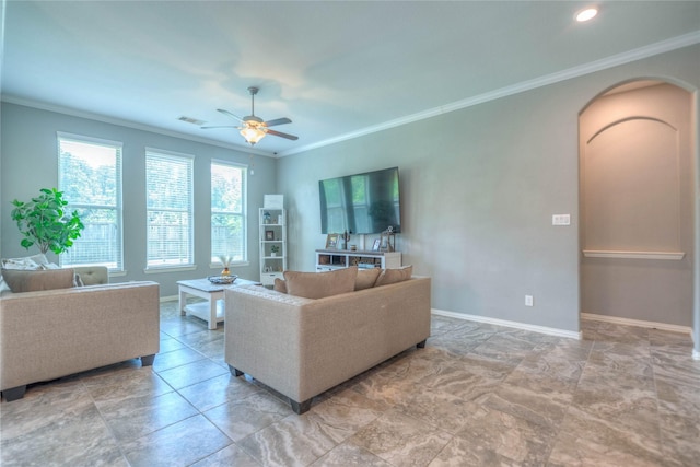 2255 Golden Laurel Dr, Conroe, TX 77304 - living room featuring ornamental molding, arched walkways, ceiling fan, and baseboards