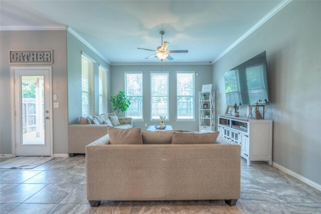 2255 Golden Laurel Dr, Conroe, TX 77304 - living area with baseboards, a ceiling fan, crown molding, and light stone finish flooring