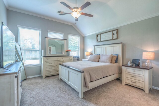 2255 Golden Laurel Dr, Conroe, TX 77304 - bedroom featuring multiple windows, light colored carpet, ornamental molding, baseboards, and lofted ceiling