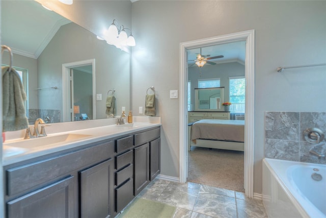 2255 Golden Laurel Dr, Conroe, TX 77304 - ensuite bathroom featuring vaulted ceiling, crown molding, a tub, double vanity, and ceiling fan