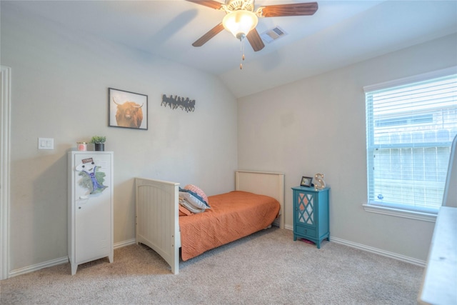2255 Golden Laurel Dr, Conroe, TX 77304 - bedroom with light colored carpet, lofted ceiling, baseboards, and a ceiling fan