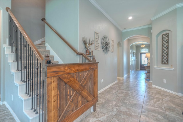 2255 Golden Laurel Dr, Conroe, TX 77304 - foyer featuring arched walkways, crown molding, baseboards, stairway, and recessed lighting