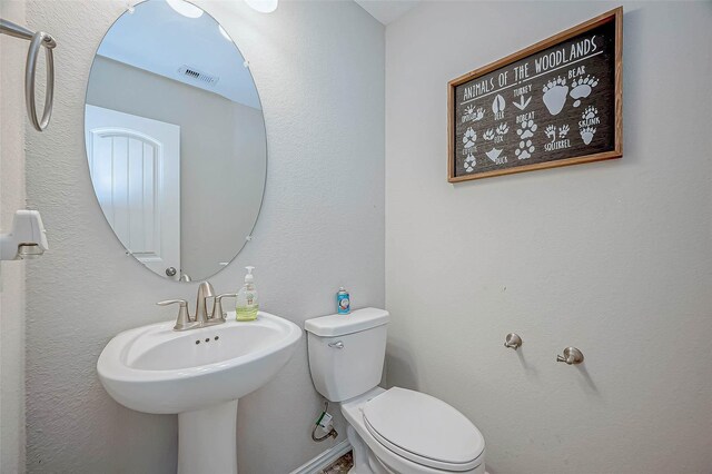 2255 Golden Laurel Dr, Conroe, TX 77304 - bathroom with toilet and a sink
