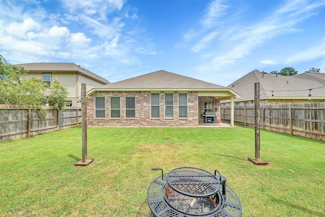 2255 Golden Laurel Dr, Conroe, TX 77304 - back of property with brick siding and a patio area