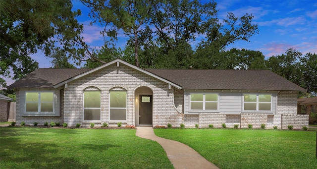 2610 Moss Hill Dr, Houston, TX 77080 - view of front of home featuring brick siding, a yard, and a shingled roof