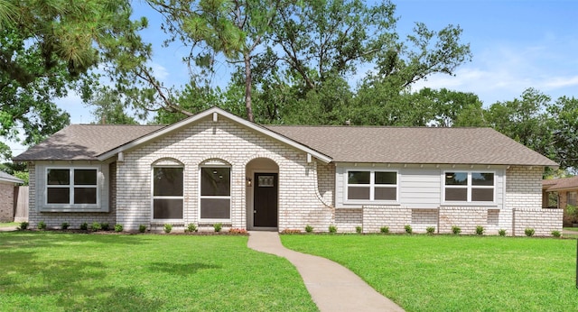 2610 Moss Hill Dr, Houston, TX 77080 - view of front of house with a front yard, brick siding, and a shingled roof