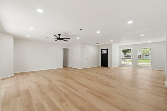 2610 Moss Hill Dr, Houston, TX 77080 - unfurnished living room with recessed lighting, light wood-type flooring, a ceiling fan, and baseboards