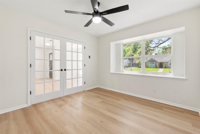 2610 Moss Hill Dr, Houston, TX 77080 - unfurnished room featuring french doors, wood finished floors, baseboards, and a ceiling fan