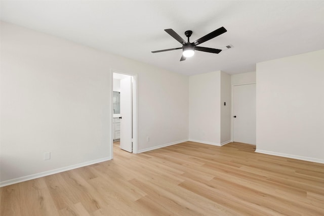 2610 Moss Hill Dr, Houston, TX 77080 - spare room featuring light wood-style floors, a ceiling fan, and baseboards