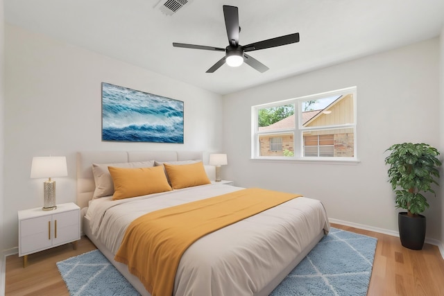 2610 Moss Hill Dr, Houston, TX 77080 - bedroom featuring light wood-style flooring, baseboards, and ceiling fan