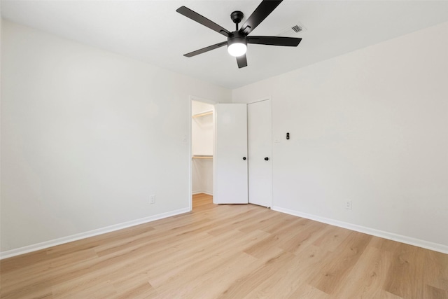 2610 Moss Hill Dr, Houston, TX 77080 - empty room with light wood finished floors, baseboards, and a ceiling fan