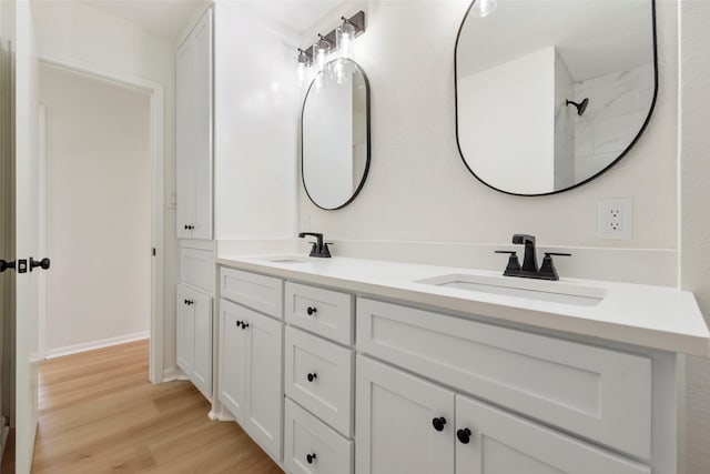 2610 Moss Hill Dr, Houston, TX 77080 - full bathroom with wood finished floors and double vanity