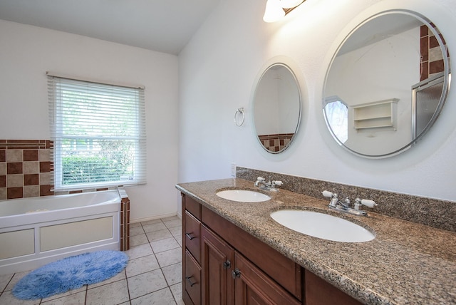 117 E 25th St, Houston, TX 77008 - bathroom with double vanity, a garden tub, and tile patterned floors