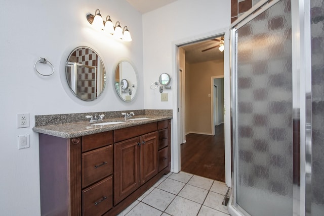 117 E 25th St, Houston, TX 77008 - full bathroom with double vanity, a shower stall, ceiling fan, and tile patterned floors