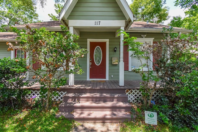 117 E 25th St, Houston, TX 77008 - property entrance featuring a porch and a shingled roof