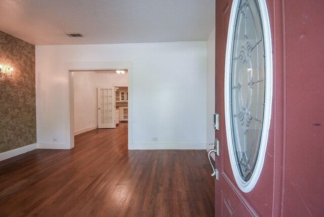 117 E 25th St, Houston, TX 77008 - entrance foyer featuring baseboards and dark wood-style flooring