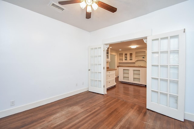 117 E 25th St, Houston, TX 77008 - unfurnished room featuring a ceiling fan, dark wood-style flooring, and baseboards