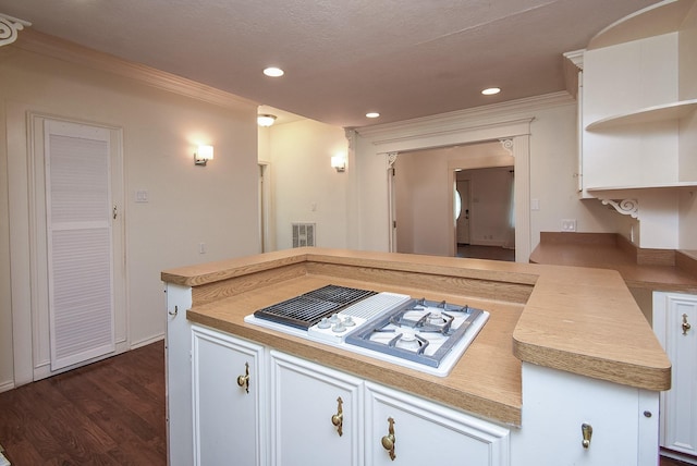 117 E 25th St, Houston, TX 77008 - kitchen with crown molding, stovetop with downdraft, open shelves, dark wood-type flooring, and light countertops