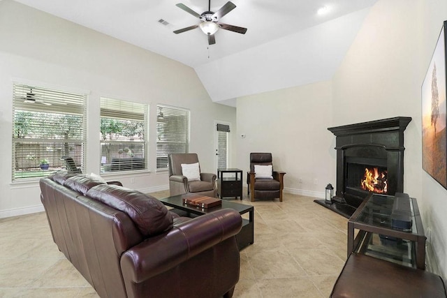 266 Overland Trce, Montgomery, TX 77316 - living room featuring a ceiling fan, lofted ceiling, light tile patterned floors, a lit fireplace, and baseboards