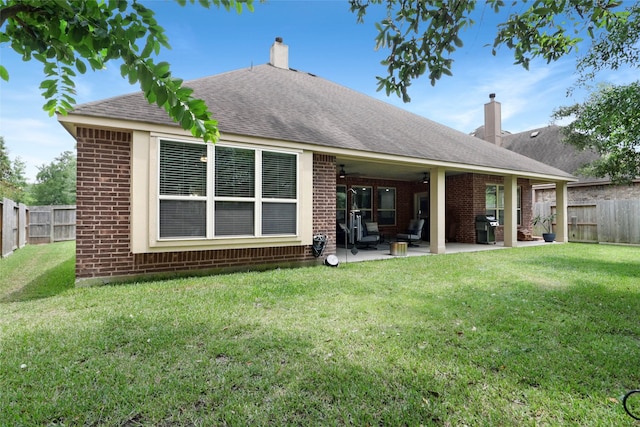 266 Overland Trce, Montgomery, TX 77316 - rear view of property featuring brick siding, a patio, a chimney, a shingled roof, and ceiling fan