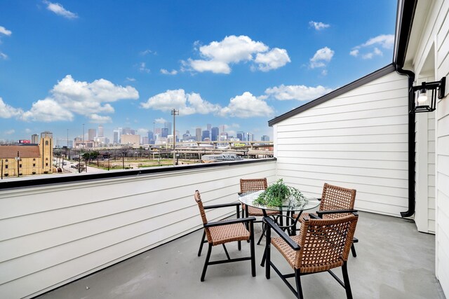 2105 Emancipation Ave, Houston, TX 77003 - balcony featuring a view of skyline and outdoor dining area