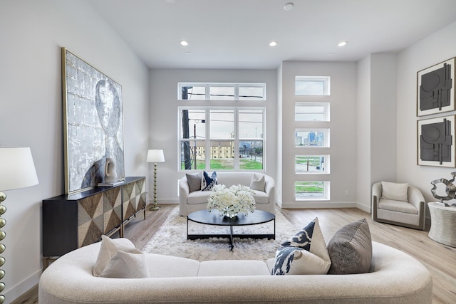 2105 Emancipation Ave, Houston, TX 77003 - living room with wood finished floors, recessed lighting, and baseboards