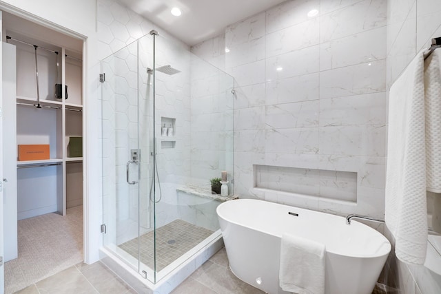 2105 Emancipation Ave, Houston, TX 77003 - bathroom with a shower stall, a freestanding tub, tile walls, and recessed lighting