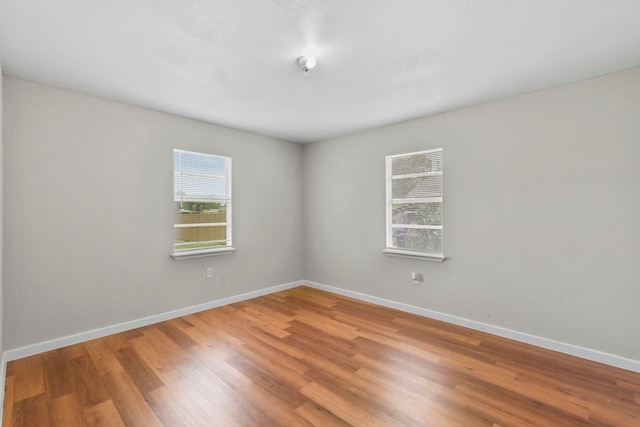 3221 Hage St, Houston, TX 77093 - empty room with wood finished floors and baseboards