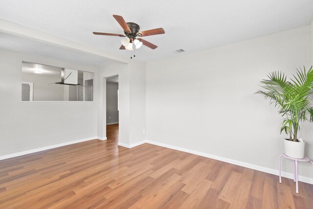3221 Hage St, Houston, TX 77093 - unfurnished room with light wood-type flooring, a ceiling fan, and baseboards