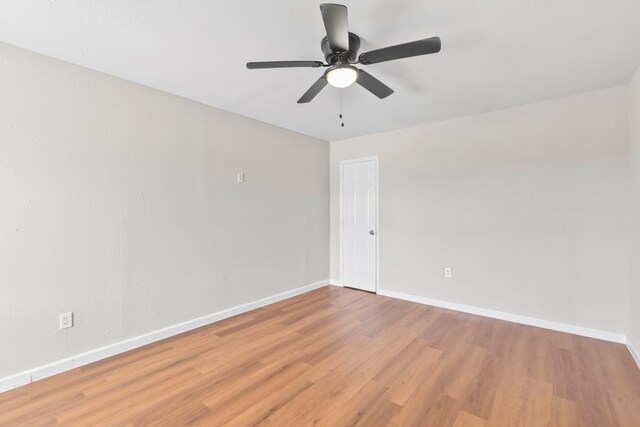 3221 Hage St, Houston, TX 77093 - unfurnished room featuring wood finished floors, baseboards, and ceiling fan