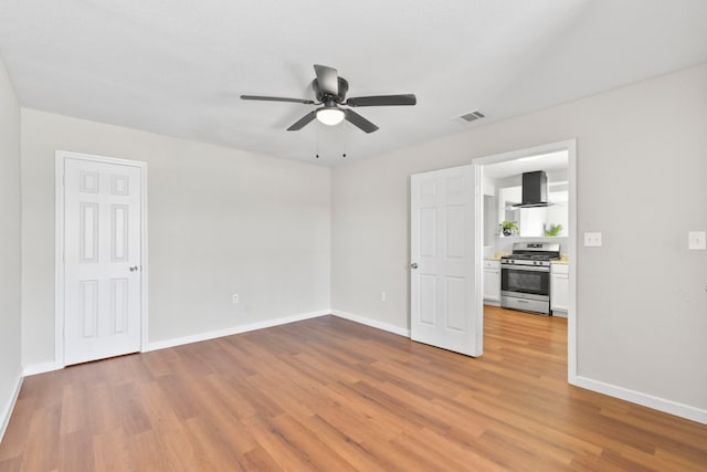 3221 Hage St, Houston, TX 77093 - empty room featuring light wood-style floors, ceiling fan, and baseboards
