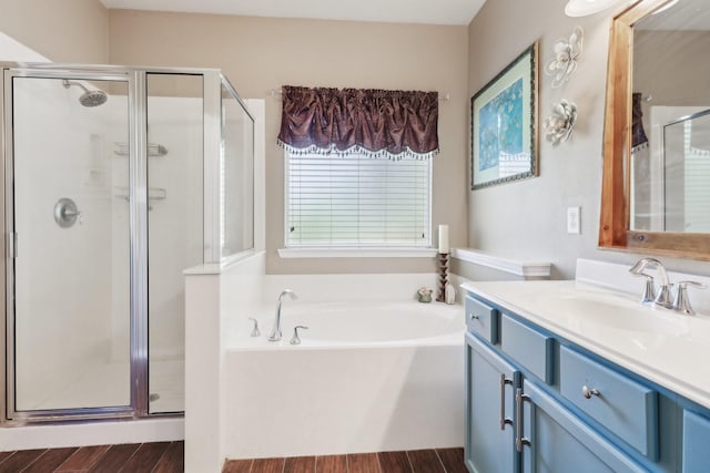 14039 Pawnee Bend Dr, Cypress, TX 77429 - bathroom with a shower stall, a garden tub, vanity, and wood finished floors