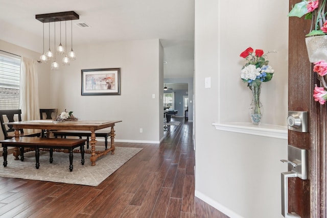 14039 Pawnee Bend Dr, Cypress, TX 77429 - dining space featuring dark wood finished floors, baseboards, and a chandelier
