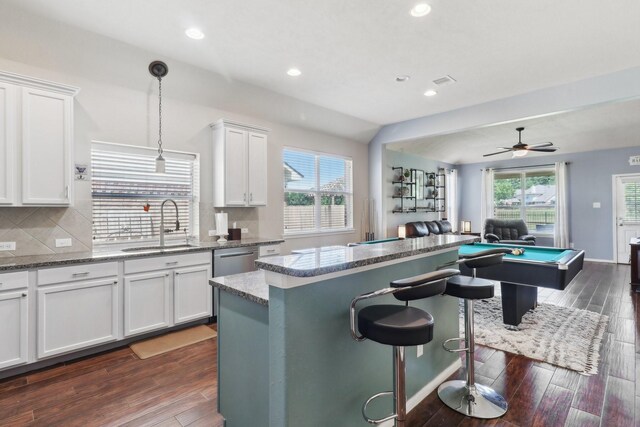 14039 Pawnee Bend Dr, Cypress, TX 77429 - kitchen with open floor plan, a sink, backsplash, recessed lighting, and a kitchen island