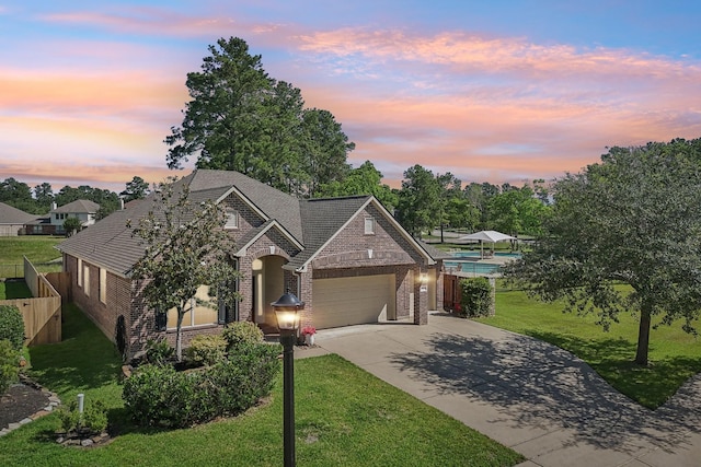 14039 Pawnee Bend Dr, Cypress, TX 77429 - view of front facade featuring brick siding, an attached garage, and concrete driveway