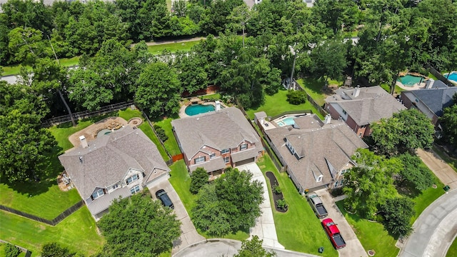 aerial view of residential area with a pool area