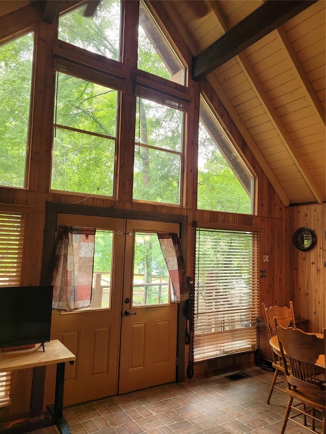 20 Shannon St, Huntsville, TX 77320 - living area featuring healthy amount of natural light, wooden walls, french doors, and wood ceiling